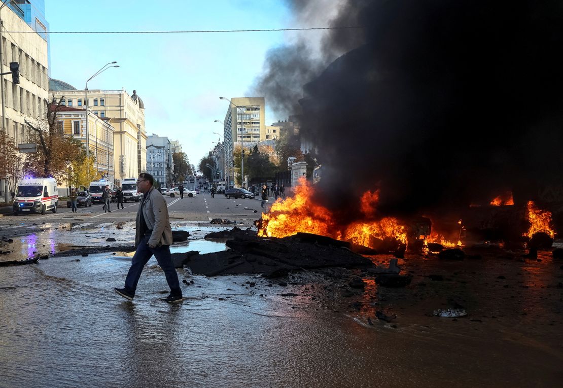 Cars burn after a Russian military strike in central Kyiv, Ukraine, October 10.