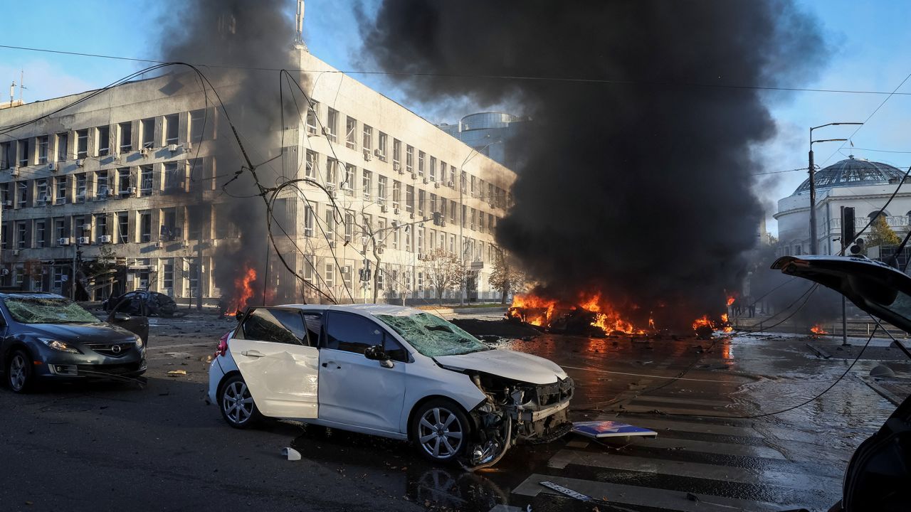 Cars burn after a Russian military strike in central Kyiv on October 10.