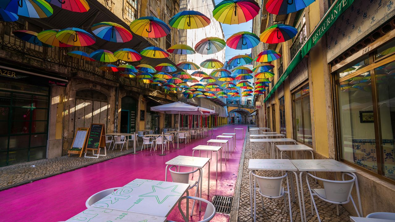 <strong>The world's coolest neighborhoods:</strong> Time Out has named the best 'hoods around the world. One standout is Cais do Sodré, in Lisbon, which is home to this colorful street. Click through to see more.