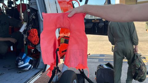 One of the boater's life jackets was torn due to shark attacks.