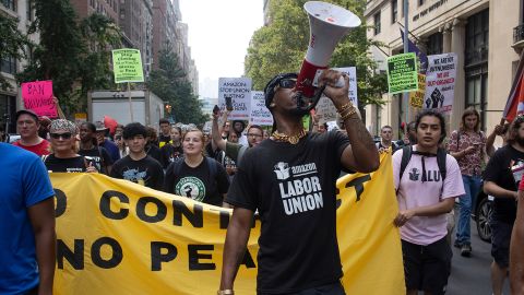 Chris Smalls, a leader of the Amazon Labor Union, leads a march of Starbucks and Amazon workers and their allies to the homes of their CEOs to protest union busting on Labor Day, September 5, 2022, in New York City, New York. 