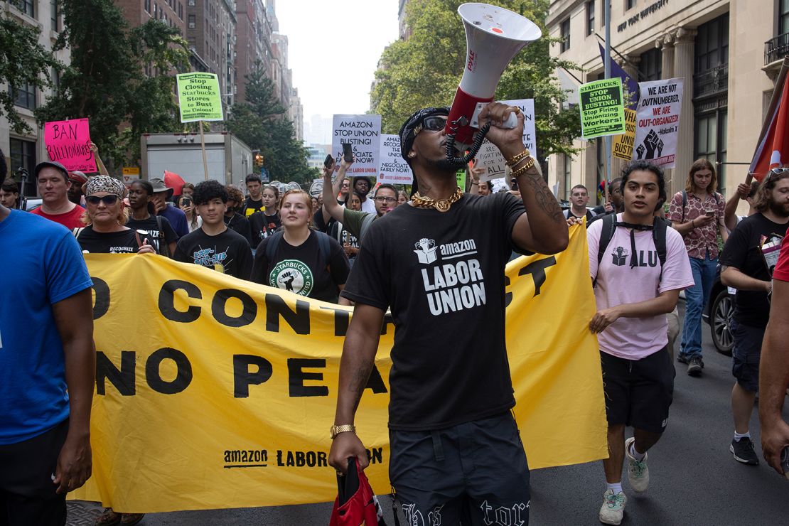 Chris Smalls, a leader of the Amazon Labor Union, leads a march of Starbucks and Amazon workers and their allies to the homes of their CEOs to protest union busting on Labor Day, September 5, 2022, in New York City, New York. 