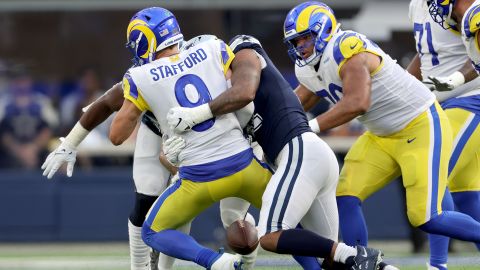 Micah Parsons of the Dallas Cowboys fires Rams QB Matthew Stafford causing a fumble.