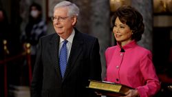 WASHINGTON, DC - JANUARY 03: Senate Majority Leader Mitch McConnell (R-KY) waits to be sworn-in with his wife Elaine Chao, U.S. Secretary of Transportation, at the U.S. Capitol on January 3, 2021 in Washington, D.C. The 117th Congress begins today with the election of the Speaker of the House and administration of the oath of office for lawmakers in both chambers, procedures that will be modified to account for Covid-19 precautions. (Photo by Samuel Corum-Pool/Getty Images)