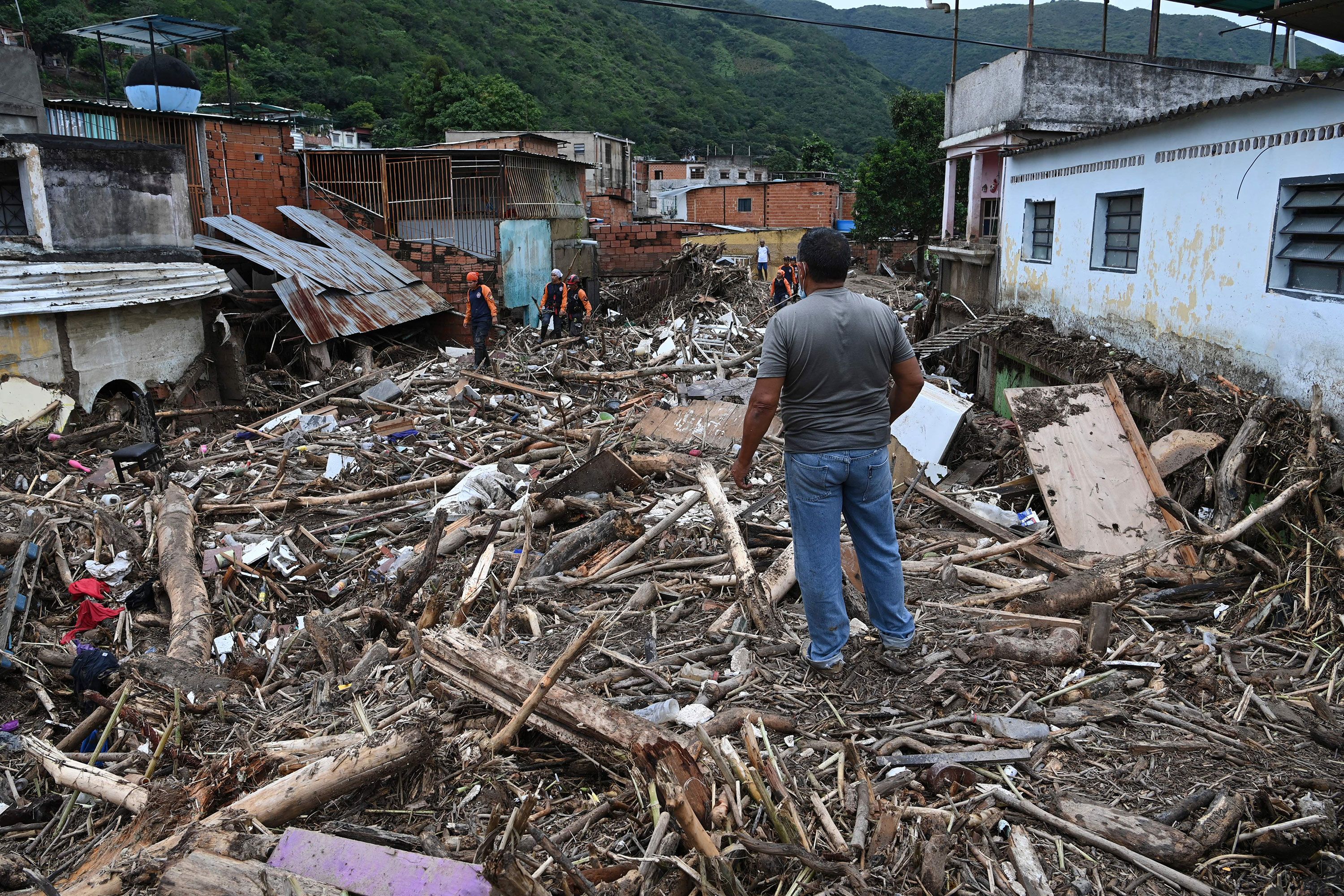 A man looks at the rubble of destroyed houses in Las Tejerias on Sunday.