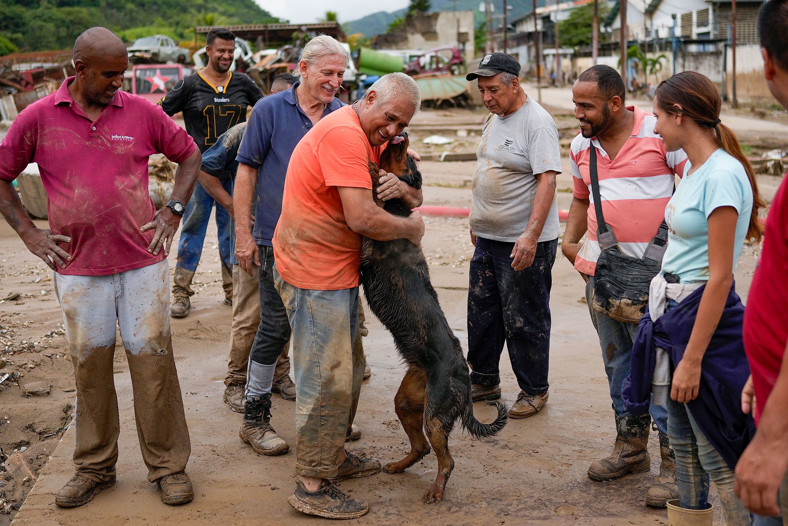 A man reunites with his dog that was rescued by neighbors on Sunday.