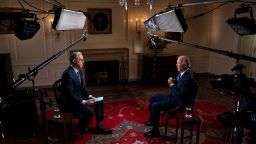 President Joe Biden speaks with CNN's Jake Tapper during an interview in the Map Room of the White House in Washington, D.C., U.S., October 11, 2022. Photo by Sarah Silbiger for CNN