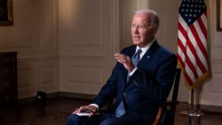 President Joe Biden speaks with CNN's Jake Tapper during an interview in the Map Room of the White House in Washington, D.C., U.S., October 11, 2022. Photo by Sarah Silbiger for CNN