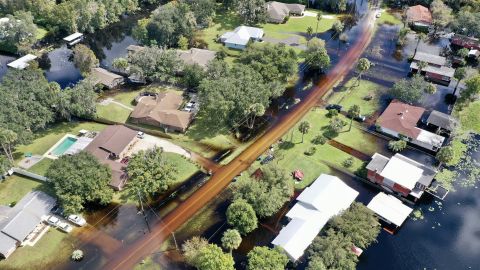Water from the St. Johns River pushes into a neighborhood in DeLand.