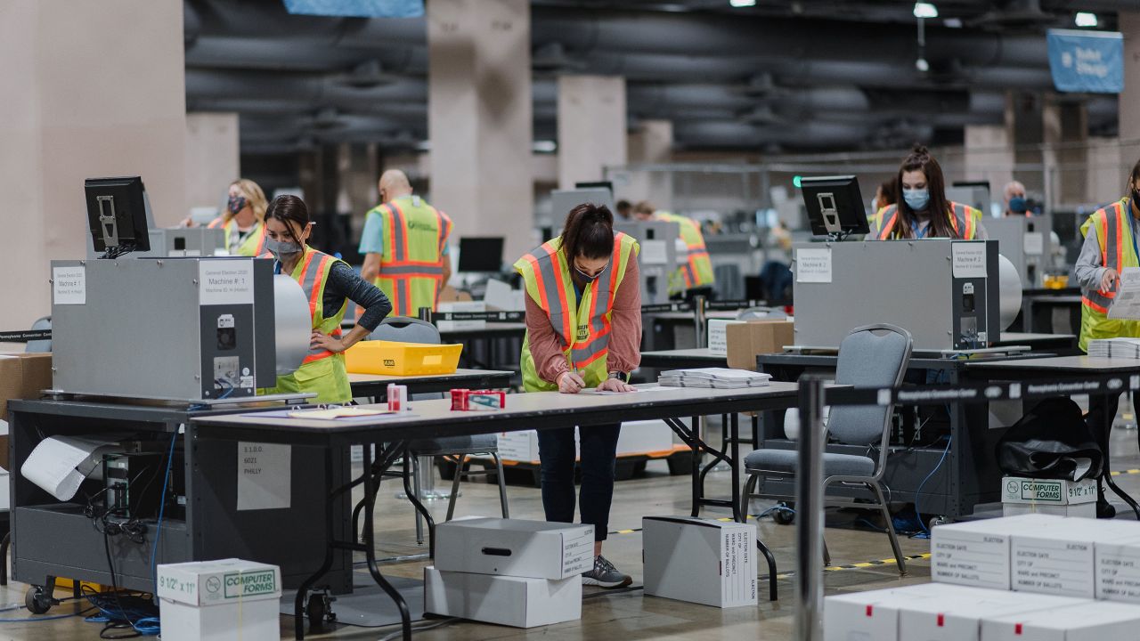 Workers count ballots for the 2020 presidential election at the Philadelphia Convention Center on Tuesday, Nov. 3, 2020.