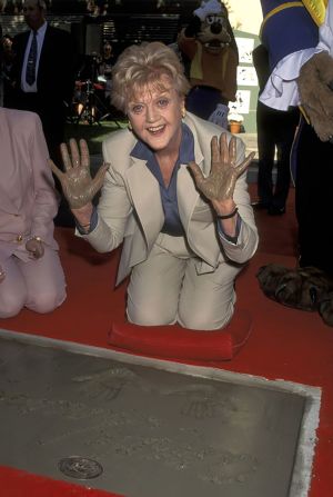 Lansbury leaves her handprints during a Disney Legends event in 1995.