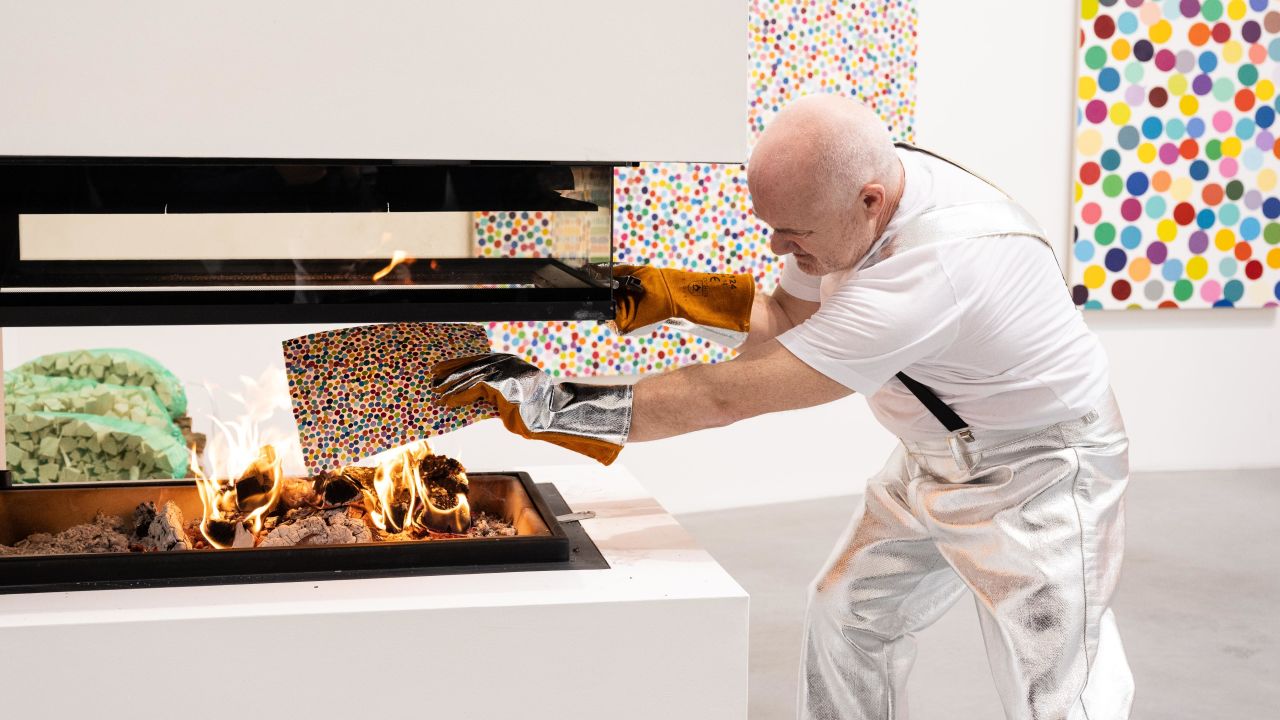 LONDON, ENGLAND - OCTOBER 11: Damien Hirst takes part in the burning of his artworks at Newport Street Gallery on October 11, 2022 in London, England. In July 2021, a collection of 10,000 NFTs by Damien Hirst were launched with corresponding physical artworks. Collectors were given the option of keeping the NFT or exchanging for the physical artwork. Over the course of Frieze week, Damien Hirst will burn over 4,851 physical artworks which correspond to the NFTs that collectors decided to keep. (Photo by Jeff Spicer/Getty Images)