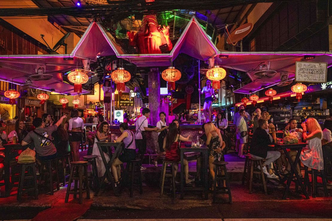 Patrons at a bar in Phuket, Thailand, on September 30.