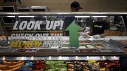Subway Restaurant workers work in tandem to prepare a sandwich for a waiting customer, as the fast food chain announced it is updating its menu with 12 new sandwiches, New York, NY, July 6, 2022. 