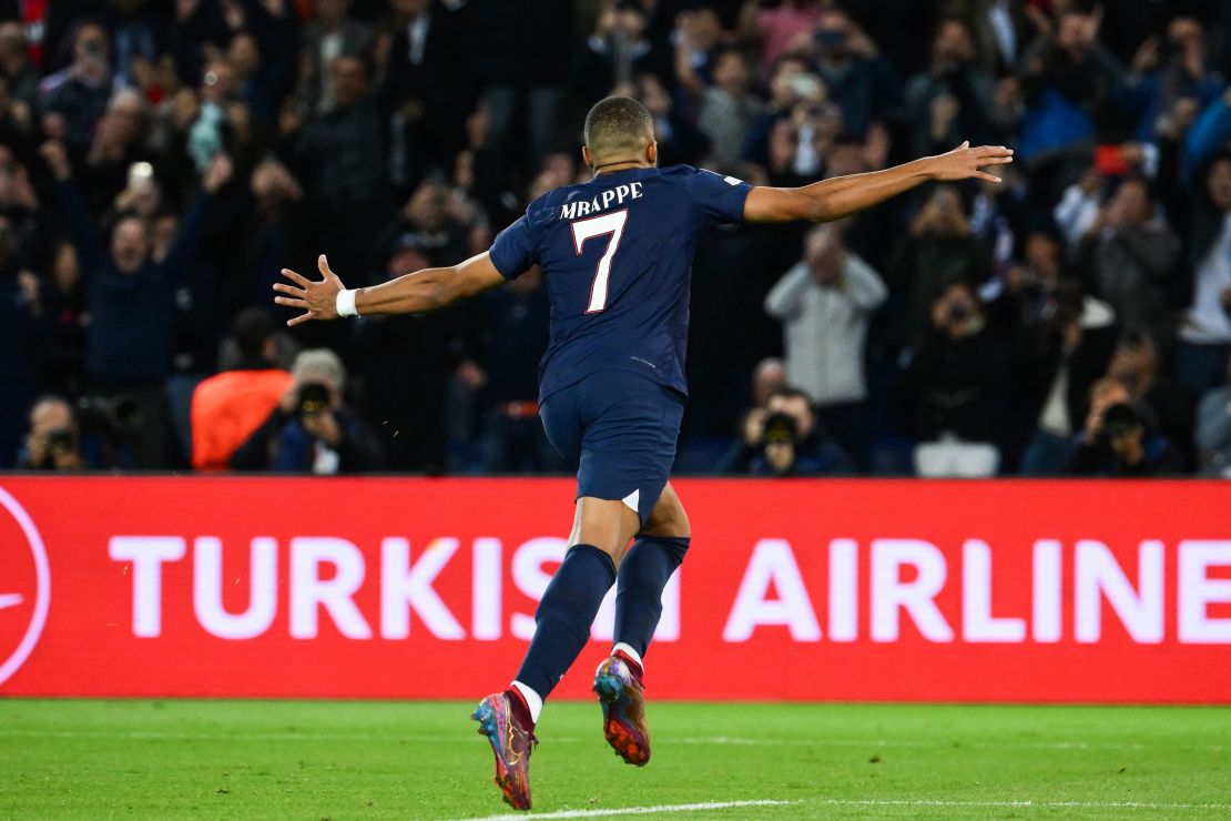 Mbappe celebrates scoring his penalty against Benfica.