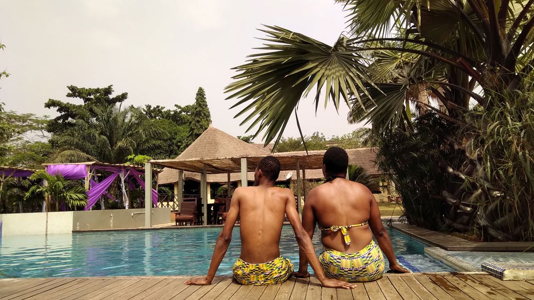 <strong>Back in Benin</strong>: Here's the couple back in Benin earlier this year, at a pool in the town of Allada. Rachel and Honoré often wear coordinating fabrics, a Benin tradition.