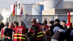 Mandatory Credit: Photo by GUILLAUME HORCAJUELO/EPA-EFE/Shutterstock (13455717f)Workers from TotalEnergies and Esso ExxonMobil attend a protest called by CGT union outside Esso refinery in Fos-Sur-Mer, France, 11 October 2022. The two weeks strike at refineries affected the country's domestic fuel output and caused shortage at French gas stations.General strikes in French refineries, Fos Sur Mer, France - 11 Oct 2022