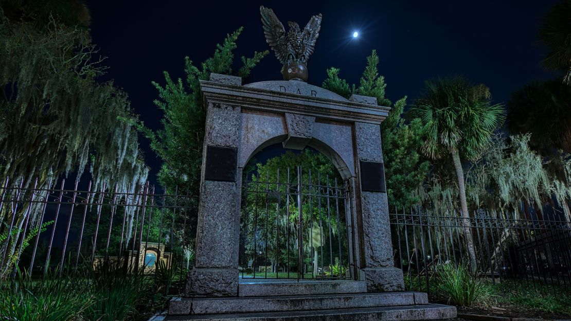 The gate to the Colonial Park Cemetery at night, with the moon shining bright upon thousands of souls buried there.