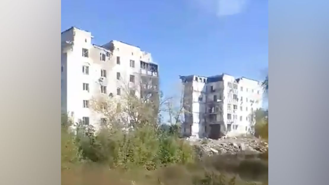 Only rubble remains between the two towers at 2 Pershotravneva in Izium, pictured on September 30. Multiple families sheltering in the basement beneath the central part of the building were killed.