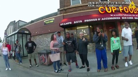 In this image from a police body camera, bystanders, including Darnella Frazier (third from right), witness then-Minneapolis police officer Derek Chauvin Pressing his knee on George Floyd's neck for several minutes killed him on May 25, 2020 in Minneapolis.