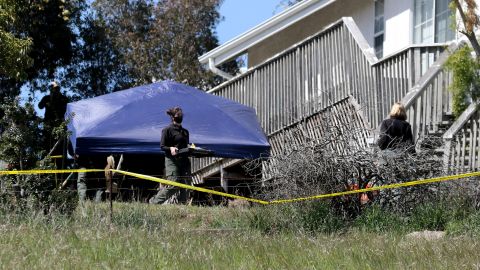 San Luis Obispo County Sheriff's Office personnel search the backyard of Ruben Flores' home on March 16, 2021 in Arroyo Grande, California. 