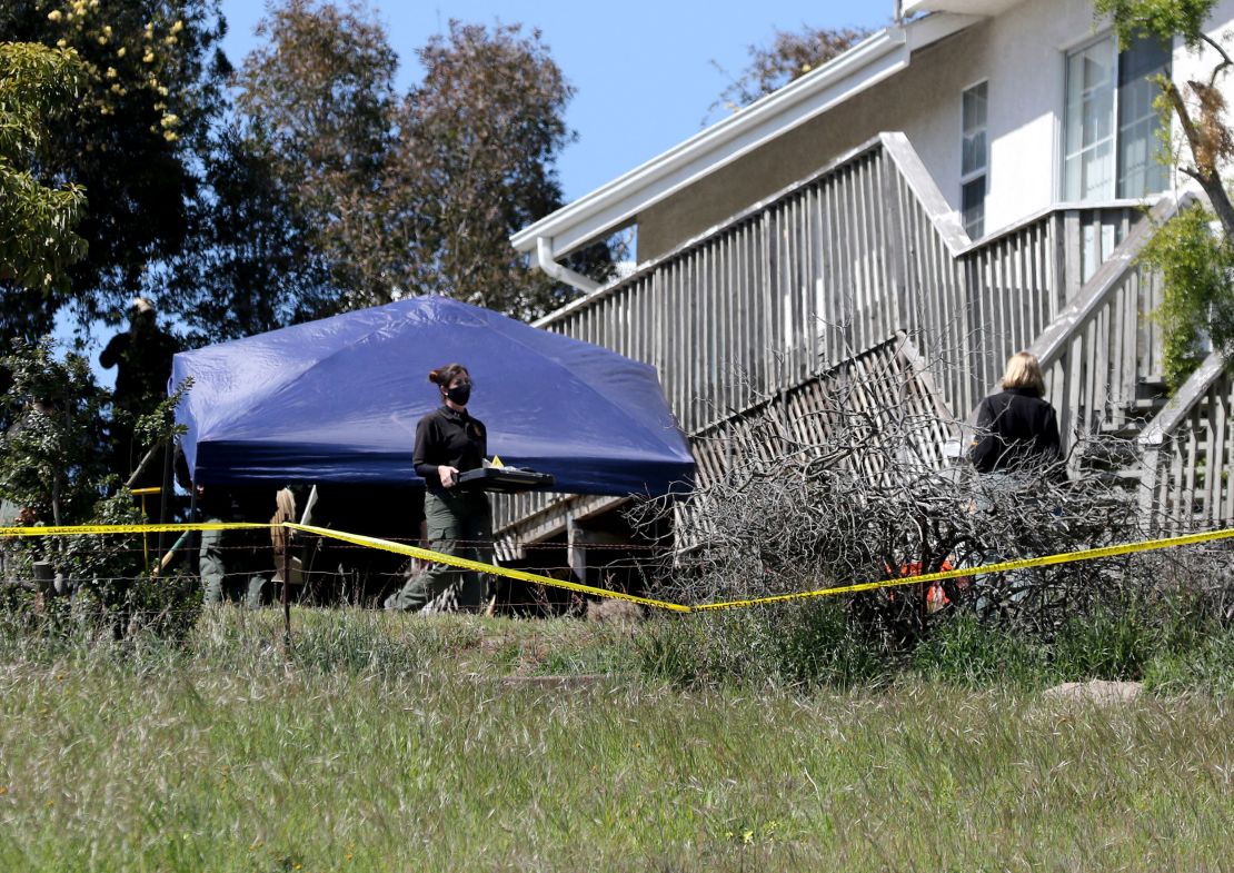 San Luis Obispo County Sheriff's Office personnel search the backyard of the home of Ruben Flores on March 16, 2021, in Arroyo Grande, California.