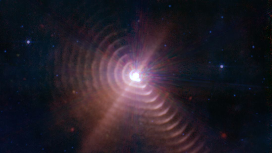 The two stars in WR140 produce shells of dust every eight years that look like rings, as captured by the Webb telescope.