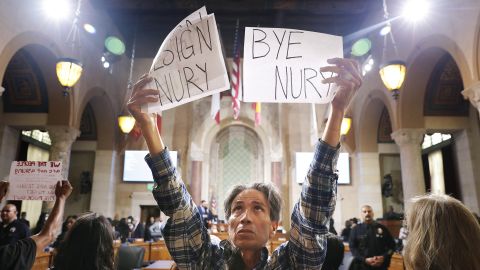 Genaro Leal joins community members calling for the resignation of Nury Martinez, Kevin de Leon and Gil Cedillo in the City Hall Council Chambers in downtown Los Angeles on October 12, 2022. 
