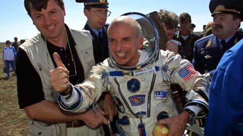 US millionaire Dennis Tito celebrates after landing near the Kazakh town of Arkalyk following his trip as the world's first space tourist in 2001. 