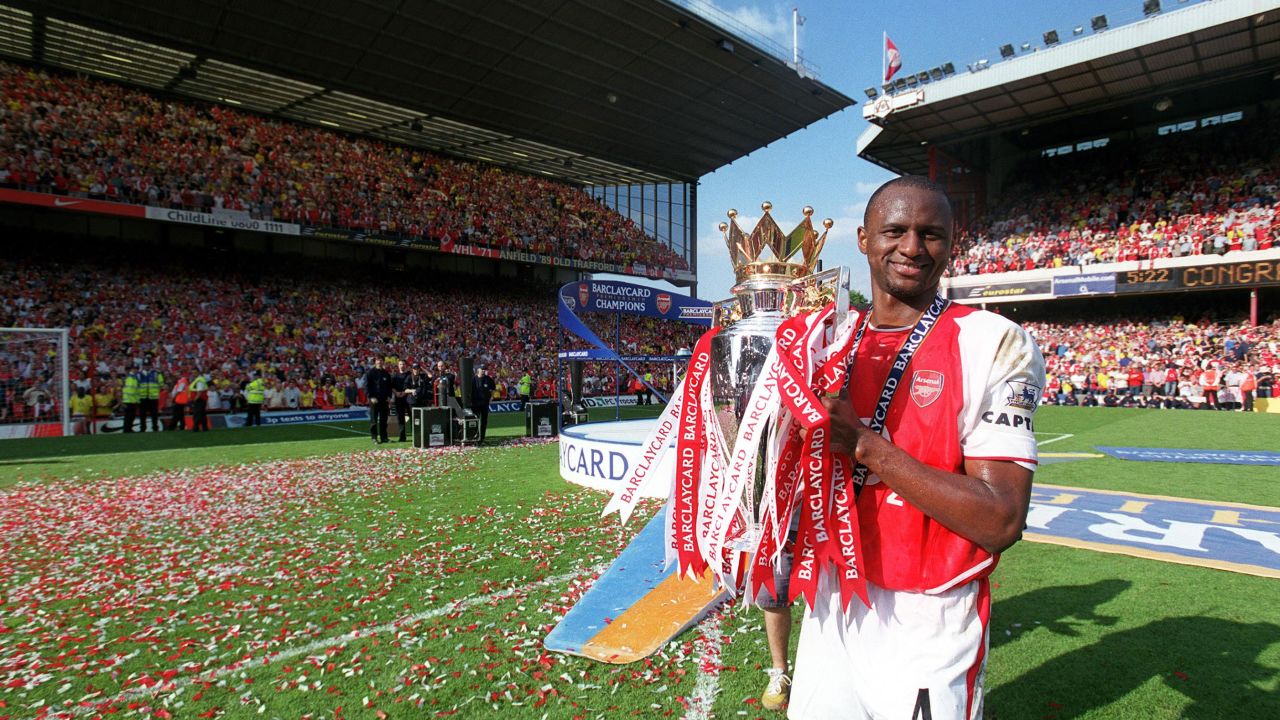 Patrick Vieira holds aloft the Premier League trophy after the Premier League match between Arsenal and Leicester City in 2004.