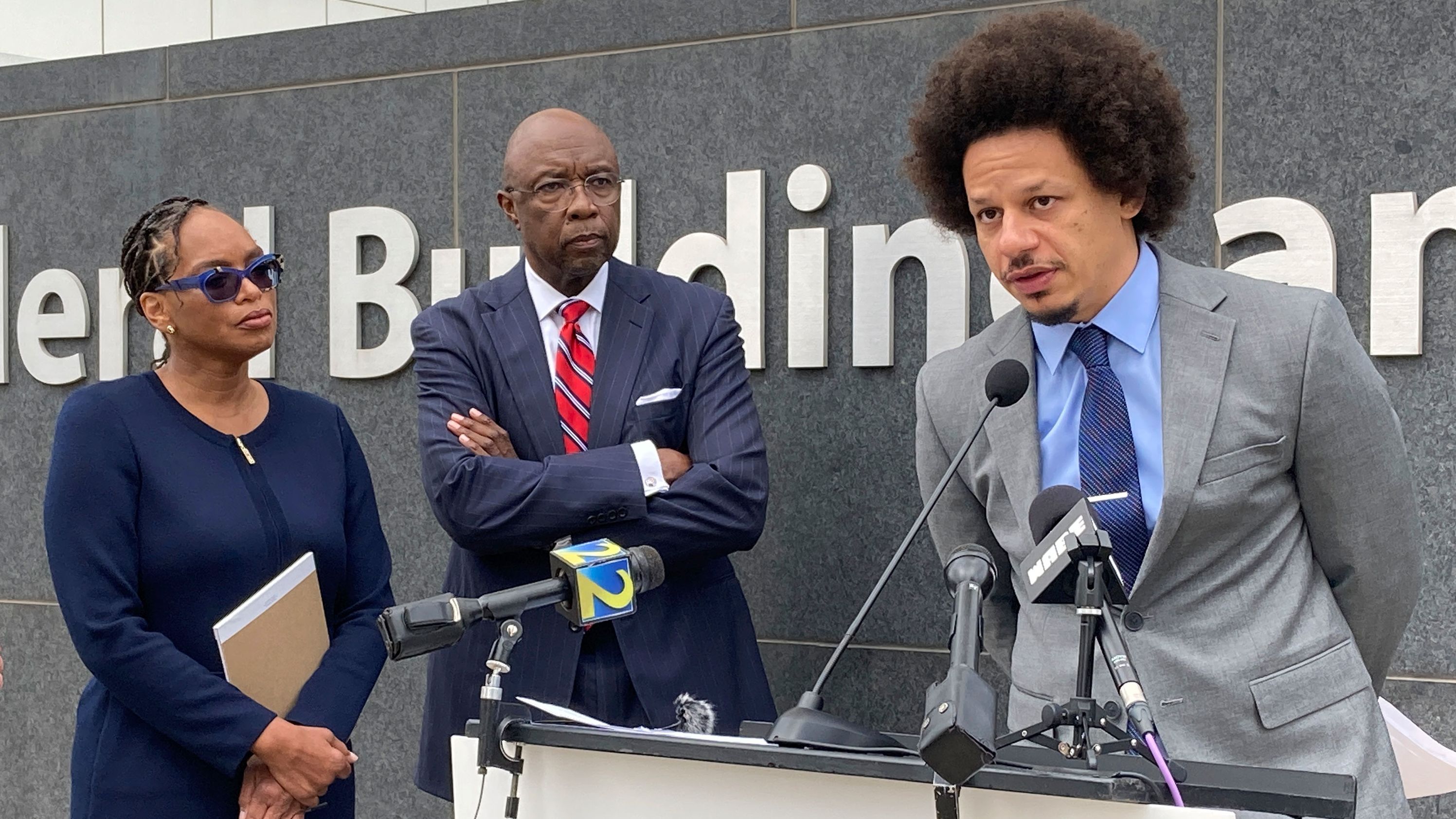 Comedian Eric André, right, speaks at a news conference in Atlanta on Tuesday.