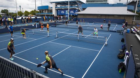 The basic aim of pickleball is to hit the ball over the net -- and stop an opponent from hitting it back.