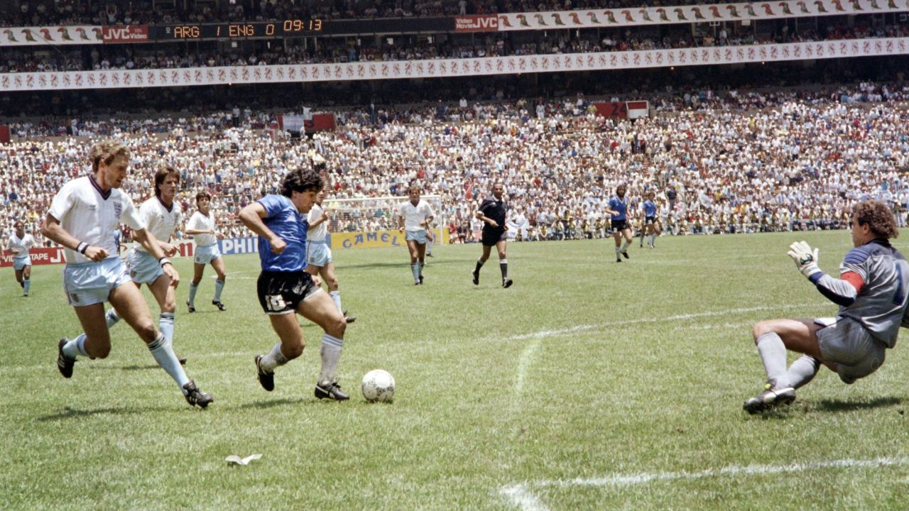 Maradona scores against England at the 1986 World Cup in Mexico. 