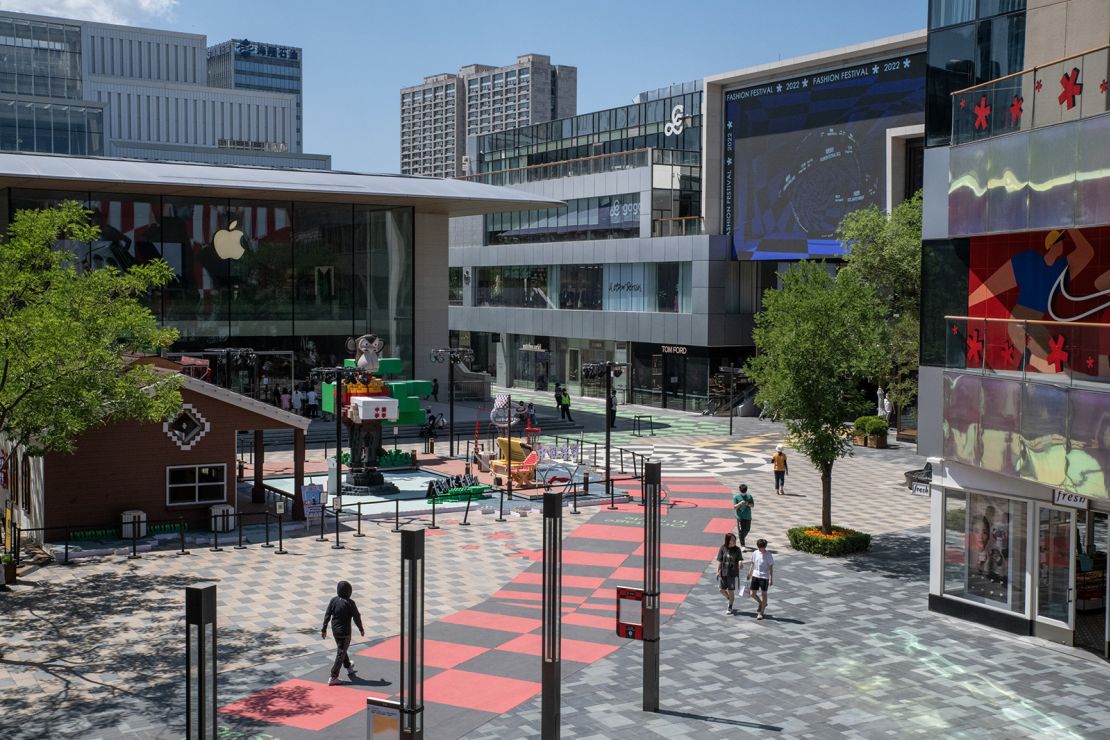 Shoppers walk through Taikoo Li Village Mall in Sanlitun in Beijing, China, on Monday, May 30, 2022.