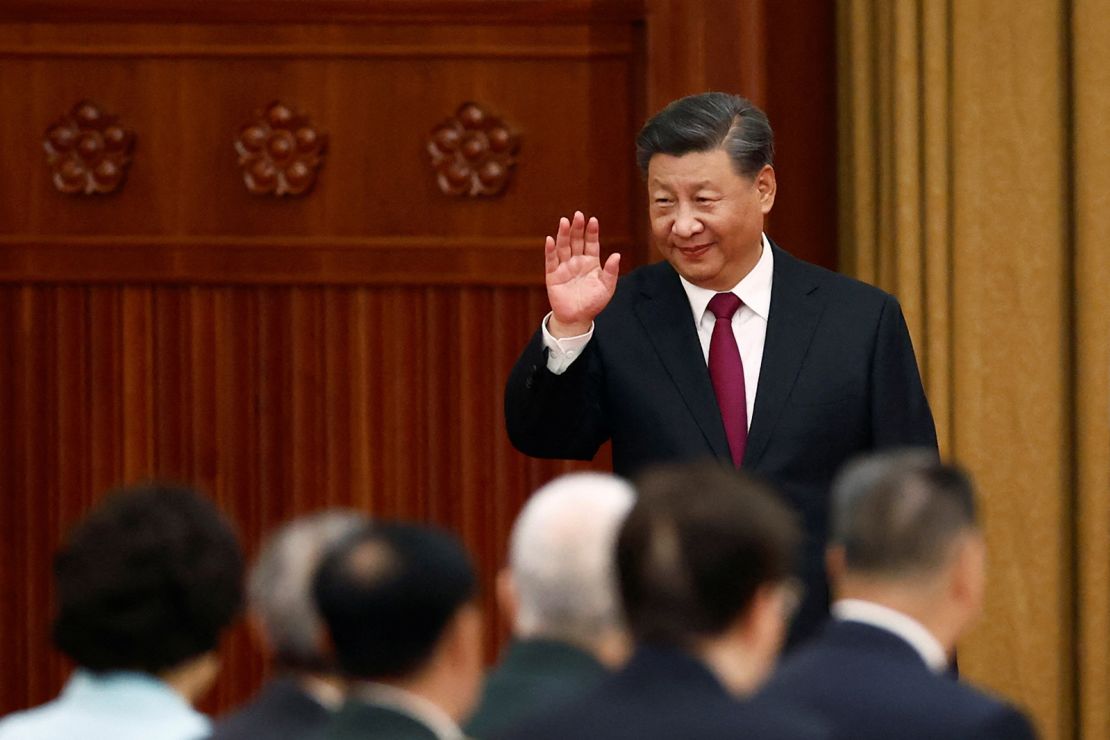 Chinese President Xi Jinping waves as he arrives for a reception at the Great Hall of the People on the eve of the Chinese National Day in Beijing, China September 30, 2022.