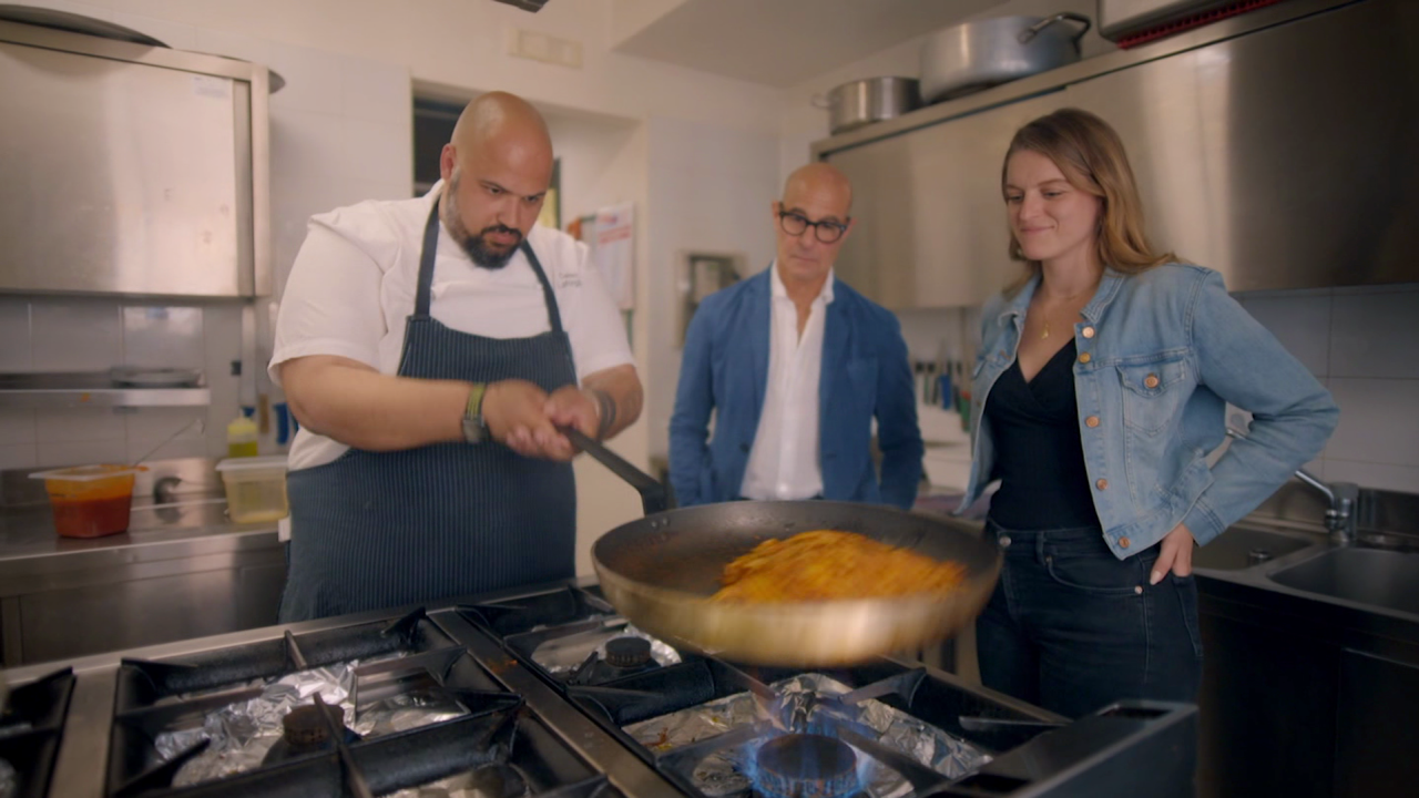 Tucci (center) is surprised to see chef Celso Laforgia (left), of Urban Bistrot in Bari, put raw spaghetti into the pan — pasta is almost never cooked this way.