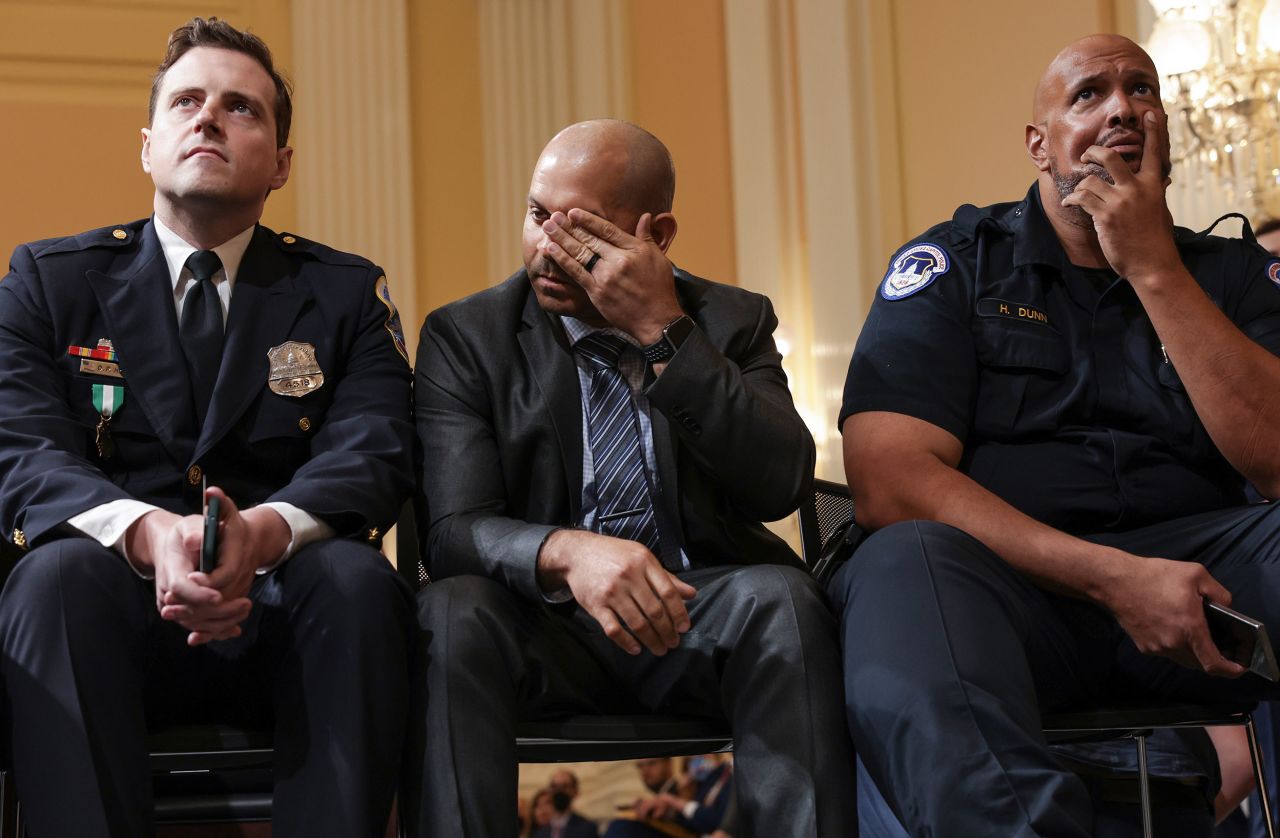 From left, Hodges, Gonell and Capitol Police Officer Harry Dunn watch Thursday's hearing.