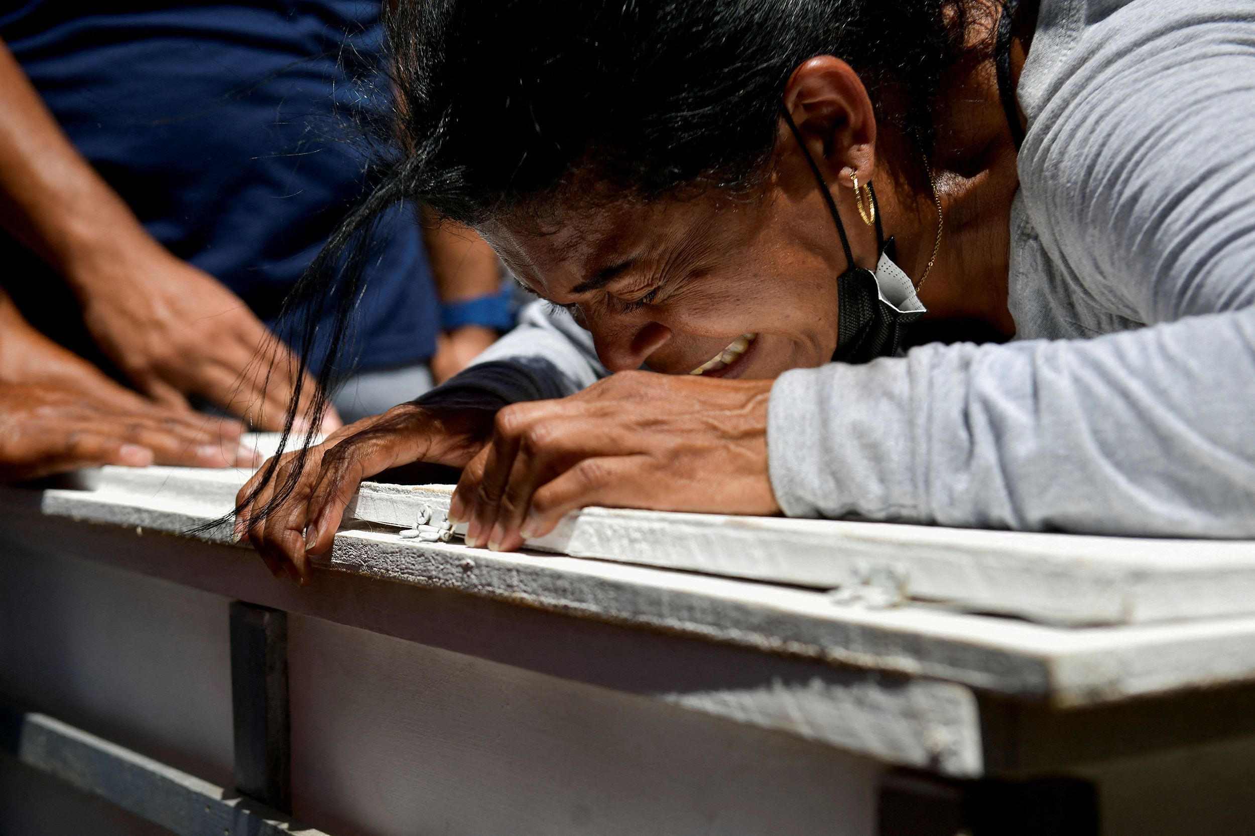 Jennifer Galindez mourns her granddaughter Damna Romero in Las Tejerias, Venezuela, on Tuesday, October 11.