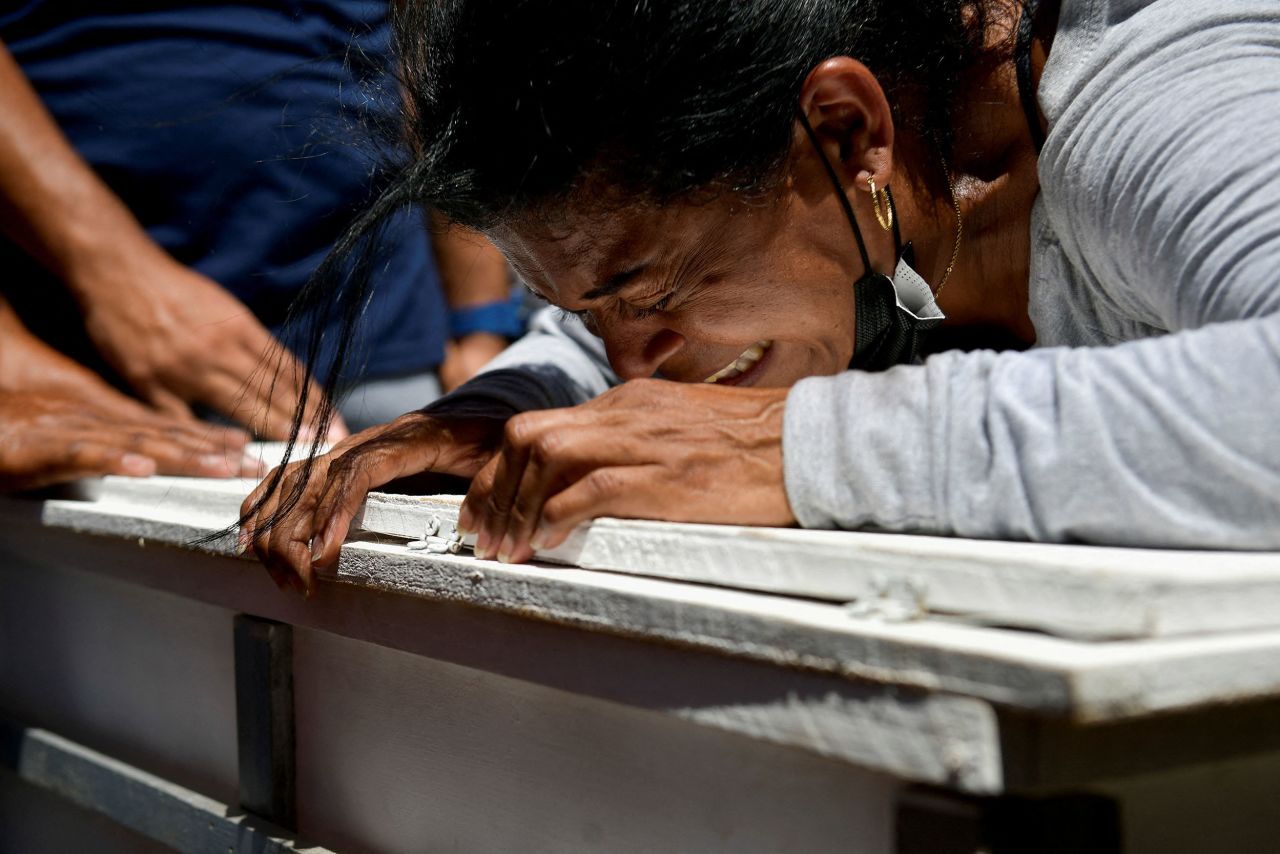 Jennifer Galindez mourns her granddaughter Damna Romero in Las Tejerias, Venezuela, on Tuesday, October 11. Days of heavy rainfall led to a <a href=