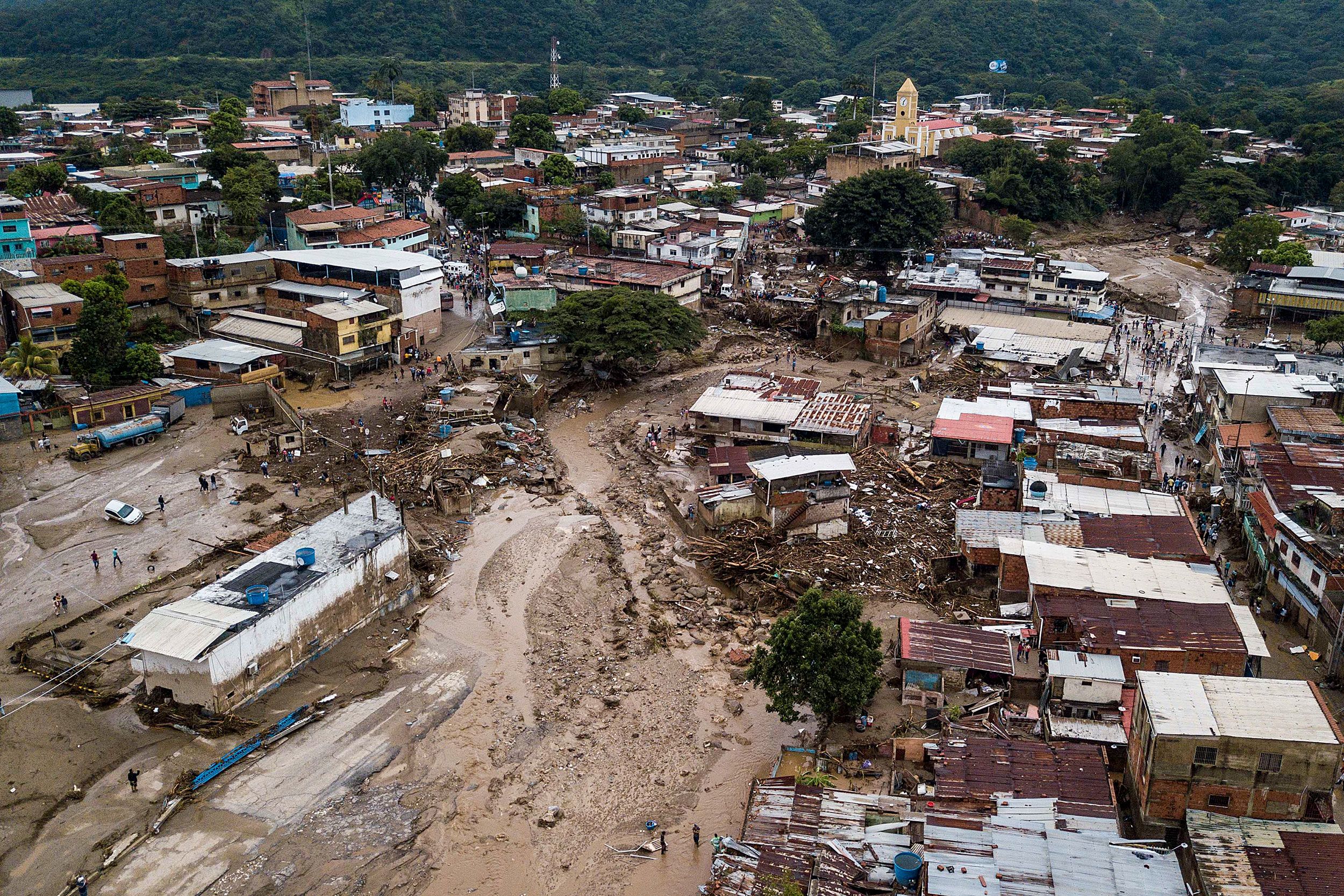 Streets are flooded in Las Tejerias, Venezuela, after heavy rains caused a deadly landslide.