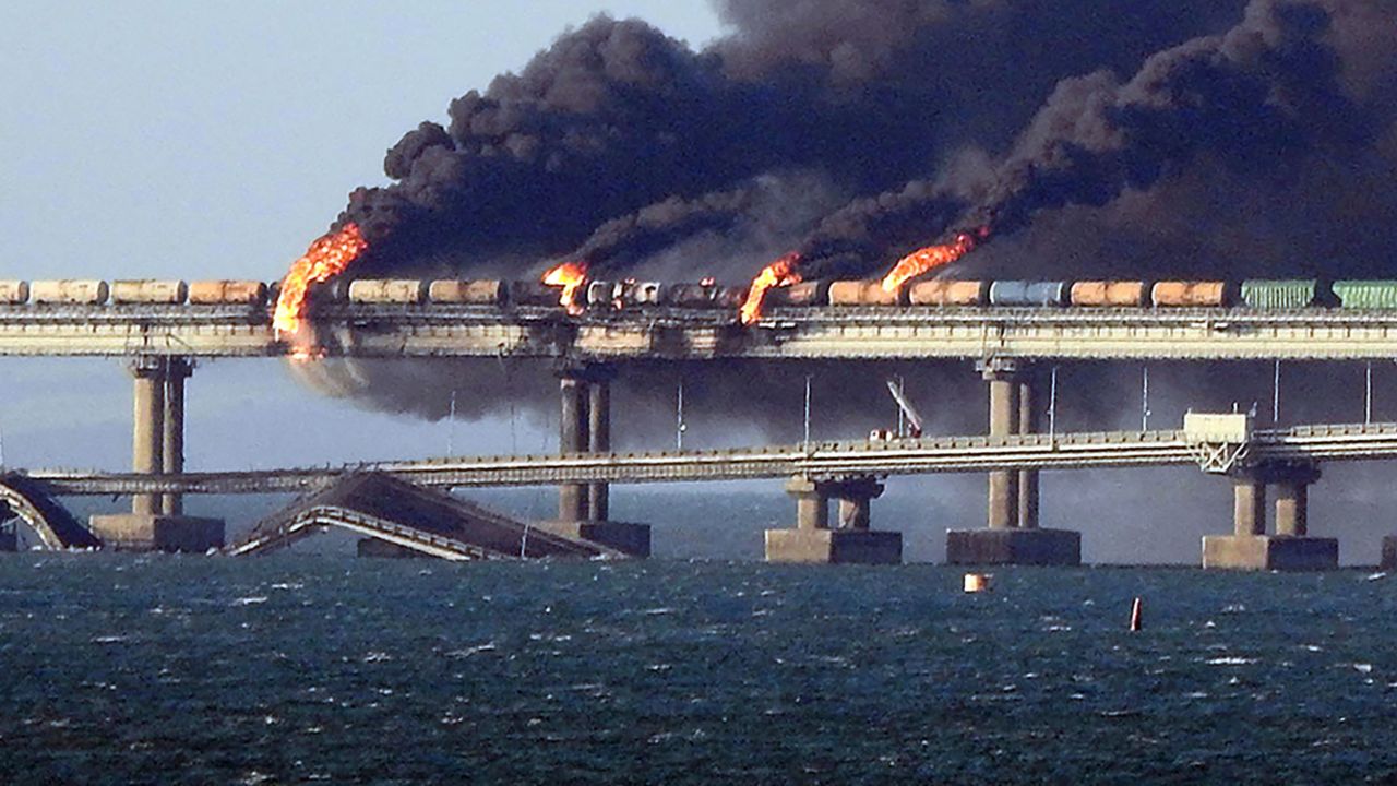 Smoke billows from the Kerch Strait road-and-rail bridge that links Crimea to Russia on Saturday, October 8.