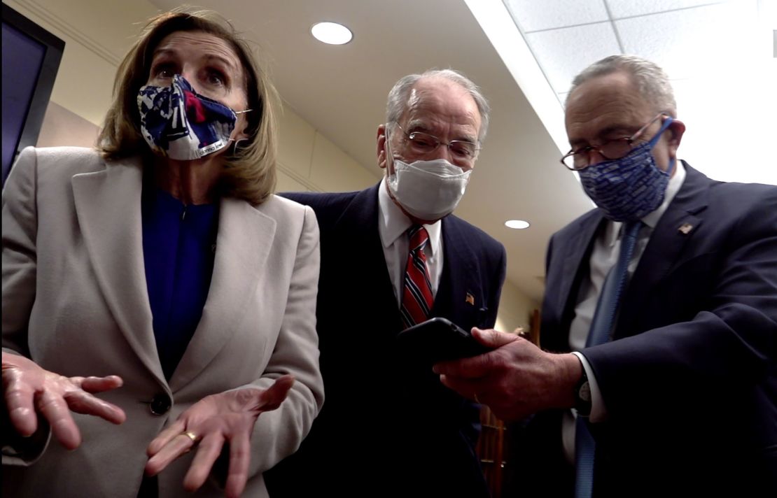 While taking refuge at Fort McNair, House Speaker Nancy Pelosi (left), Sen. Chuck Grassley (center) and then-Senate Minority Leader Chuck Schumer talk on the phone with Vice President Mike Pence on January 6, 2021. 