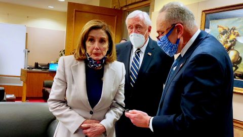 House Speaker Nancy Pelosi (left) looks at TV coverage of the January 6 insurrection, while House Majority Leader Steny Hoyer (center) and then-Senate Minority Leader Chuck Schumer talk on the phone with officials about securing the US Capitol. 