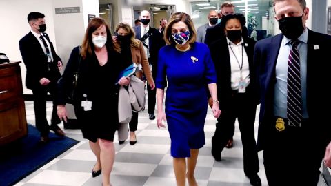 House Speaker Nancy Pelosi (center) evacuates the US Capitol during the early stages of the insurrection on January 6, 2021.