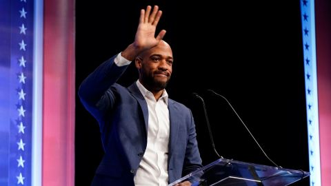 Barnes is introduced during Thursday's debate in Milwaukee. 