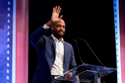 Barnes is introduced during Thursday's debate in Milwaukee. 