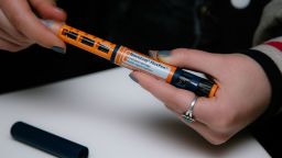 A person fastens a Becton Dickinson And Co. (BD) needle on a Novo Nordisk Inc. NovoLog brand insulin pen in a posed photograph in New York on Friday, April 5, 2019.