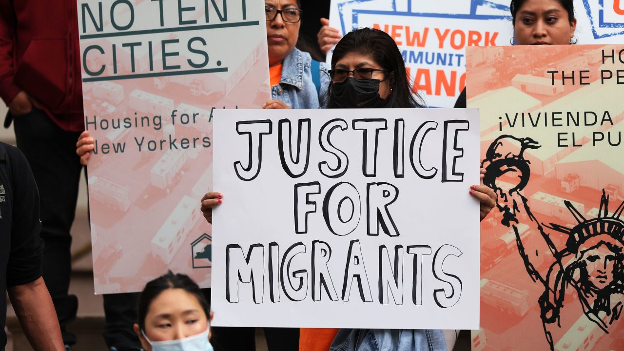Protesters at New York's City Hall on October 13 call for eviction protections, measures to provide more affordable housing and safer alternative housing options for asylum seekers.