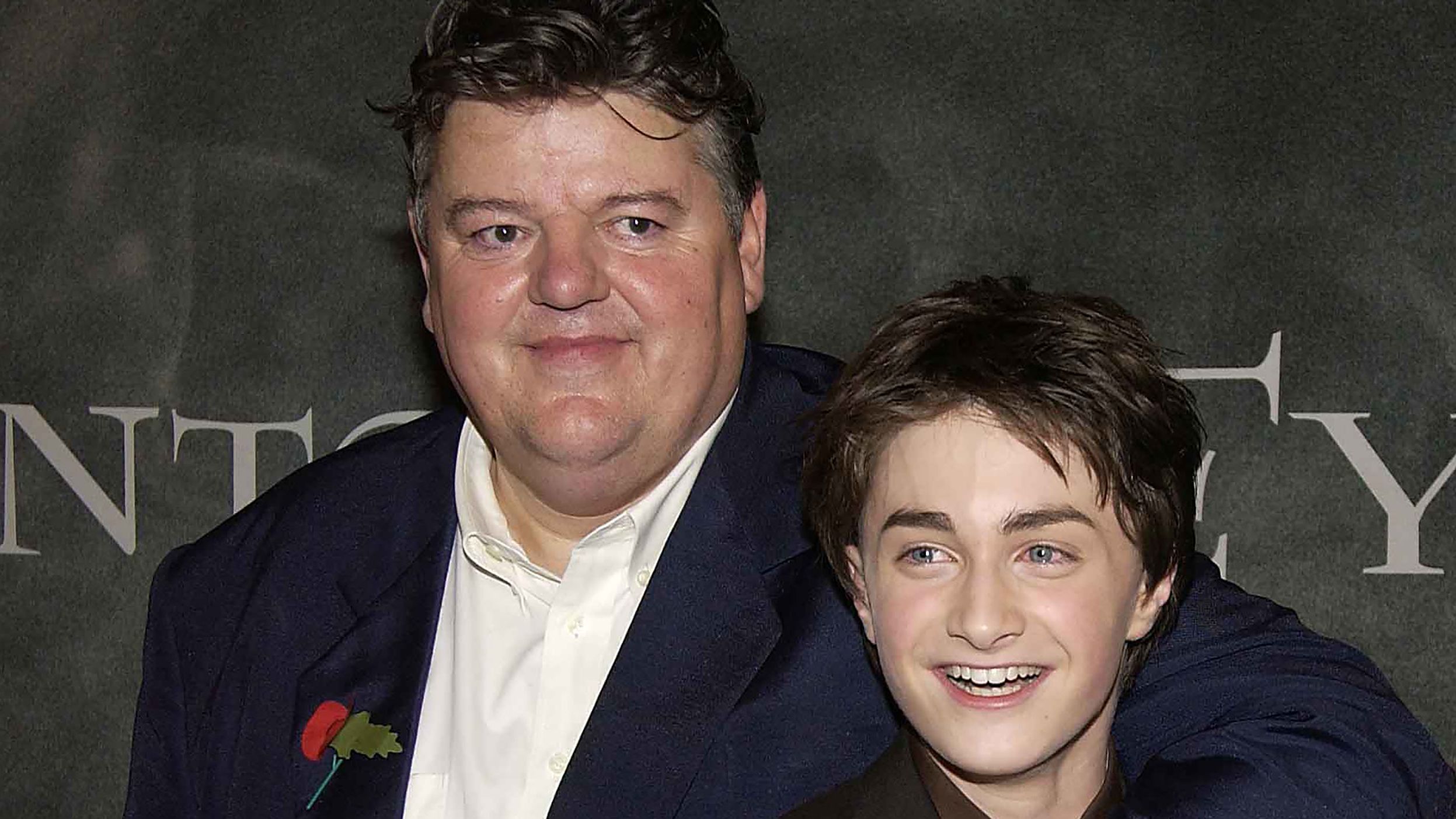 Daniel Radcliffe (right), seen here with Robbie Coltrane at the 'Harry Potter and the Chamber of Secrets' world premiere in London in 2002, paid tribute to his late costar on Friday upon learning of Coltrane's death.