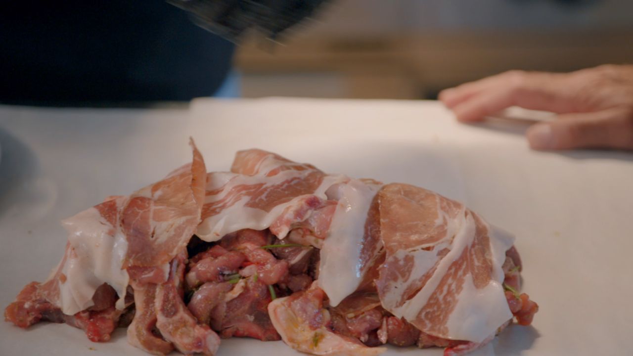 Chef Pino Trimboli of La Collinetta, in the region of Calabria, combines the lamb with aromatics and adds black Calabrian pig prosciutto.